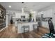 Bright kitchen features an island with bar stools, stainless appliances, and sleek white cabinetry at 2882 Ophelia Way, Myrtle Beach, SC 29577