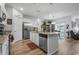 This kitchen features stainless appliances, a granite island with seating, and opens to the dining area at 2882 Ophelia Way, Myrtle Beach, SC 29577