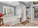 This bathroom features a soaking tub, walk-in shower, tile flooring, and a window with natural light at 3026 Cedar Creek Run, Little River, SC 29566