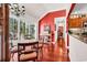 Dining room with hardwood floors, decorative lighting, and view to the modern kitchen at 3026 Cedar Creek Run, Little River, SC 29566