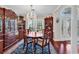 Dining room featuring hardwood floors, large windows, crystal chandelier, and elegant decor at 3026 Cedar Creek Run, Little River, SC 29566