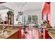 Light-filled dining room with hardwood floors and sliding glass doors to the outdoor space at 3026 Cedar Creek Run, Little River, SC 29566