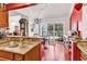 Open kitchen area leading to dining space and outdoor patio with lush greenery at 3026 Cedar Creek Run, Little River, SC 29566