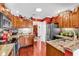Modern kitchen with stainless appliances, granite counters, and updated cabinetry at 3026 Cedar Creek Run, Little River, SC 29566