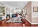 Open-concept living room with hardwood floors, fireplace, and elegant decor for comfortable living at 3026 Cedar Creek Run, Little River, SC 29566