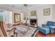 Cozy living room with hardwood floors, fireplace, and comfortable seating ideal for relaxation at 3026 Cedar Creek Run, Little River, SC 29566