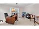 This office features natural light, a ceiling fan, a desk, and a comfortable chair at 3026 Cedar Creek Run, Little River, SC 29566