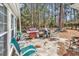 Charming outdoor patio featuring a grill, outdoor furniture, and verdant foliage at 3026 Cedar Creek Run, Little River, SC 29566