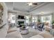 Bright living room featuring hardwood floors, large windows, and a cozy fireplace at 309 Mayflower Dr., Calabash, NC 28467