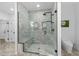 The bathroom features a frameless walk-in shower with a built-in bench and rainfall showerhead at 3700 Waterford Dr., Myrtle Beach, SC 29577
