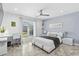 Bright bedroom with a modern white bed, desk, and a large window offering a scenic view at 3700 Waterford Dr., Myrtle Beach, SC 29577