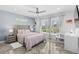 Cozy bedroom featuring a tufted headboard, stylish decor, and plenty of natural light at 3700 Waterford Dr., Myrtle Beach, SC 29577
