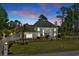 Beautiful gray home featuring lush landscaping and a well manicured front lawn at 3700 Waterford Dr., Myrtle Beach, SC 29577