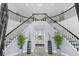 Elegant foyer featuring a grand staircase, marble floors, and sophisticated decor at 3700 Waterford Dr., Myrtle Beach, SC 29577