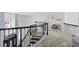 Second-floor hallway with modern chandelier and detailed stairwell at 3700 Waterford Dr., Myrtle Beach, SC 29577