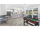 Modern kitchen with stainless steel appliances, a large island, and a foosball table at 3700 Waterford Dr., Myrtle Beach, SC 29577