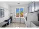 Functional laundry room with modern appliances, storage cabinets, and a bright window at 3700 Waterford Dr., Myrtle Beach, SC 29577