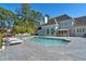 A beautiful pool surrounded by lounge chairs and lovely landscaping at 3700 Waterford Dr., Myrtle Beach, SC 29577