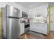 Well-equipped kitchen featuring stainless steel appliances, white cabinets, and modern backsplash at 401 Hillside Dr. N # 2F, North Myrtle Beach, SC 29582