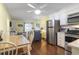 Open floor plan boasts a kitchen and living area with hardwood flooring and stainless steel appliances at 401 Hillside Dr. N # 2F, North Myrtle Beach, SC 29582