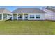 A view of the flat backyard and covered patio from the yard at 4028 Bucolic Loop, Myrtle Beach, SC 29588