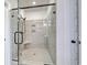 Large walk-in shower with glass door, tile surround, and built-in shower seat at 4028 Bucolic Loop, Myrtle Beach, SC 29588