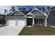 Charming single-Gathering home featuring a two-car garage and well-maintained front lawn at 4028 Bucolic Loop, Myrtle Beach, SC 29588