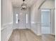 Bright hallway with light wood floors, wainscoting, and a modern pendant light at 4028 Bucolic Loop, Myrtle Beach, SC 29588