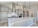 Modern kitchen with stainless steel range hood, built-in appliances, and sleek white countertops at 4028 Bucolic Loop, Myrtle Beach, SC 29588