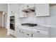 Modern kitchen featuring sleek white cabinetry and stainless appliances at 4028 Bucolic Loop, Myrtle Beach, SC 29588