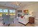 Comfortable living room with fireplace, ceiling fan, and lots of natural light at 4028 Bucolic Loop, Myrtle Beach, SC 29588