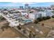 An aerial view shows a quaint blue house near the ocean and city buildings at 409 25Th Ave. N, North Myrtle Beach, SC 29582