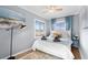 Inviting bedroom with beach-themed art, warm lighting, and a patterned rug at 409 25Th Ave. N, North Myrtle Beach, SC 29582