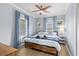 Comfortable bedroom with a ceiling fan, ample natural light, and wood flooring at 409 25Th Ave. N, North Myrtle Beach, SC 29582