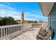 Spacious deck with comfortable chairs, offering serene views of the surrounding greenery and neighborhood at 409 25Th Ave. N, North Myrtle Beach, SC 29582
