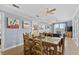 Cozy dining area with wooden table and chairs, nautical-themed decor, and easy access to other rooms at 409 25Th Ave. N, North Myrtle Beach, SC 29582
