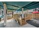 Outdoor deck space with a hot tub, wooden stairs, and adjacent seating area for ultimate relaxation at 409 25Th Ave. N, North Myrtle Beach, SC 29582