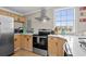 Bright kitchen with stainless steel appliances, light wood cabinets, and views of the community at 409 25Th Ave. N, North Myrtle Beach, SC 29582