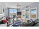 Comfortable living room with ample seating, a TV, large windows, and access to an outdoor balcony at 409 25Th Ave. N, North Myrtle Beach, SC 29582