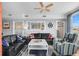Cozy living room with nautical decor, comfortable seating, and bright natural light from large windows at 409 25Th Ave. N, North Myrtle Beach, SC 29582