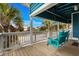 Inviting porch featuring a comfortable swing and tranquil views of the surrounding neighborhood at 409 25Th Ave. N, North Myrtle Beach, SC 29582