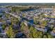 An aerial view showcases a vast residential area with multiple ponds and water features at 4173 Hibiscus Dr. # 204, Little River, SC 29566