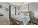 Comfortable bedroom featuring neutral tones, a wood frame bed, and natural light from a window at 4173 Hibiscus Dr. # 204, Little River, SC 29566