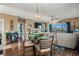 Open-concept dining room featuring wood floors and large windows offering natural light and neighborhood views at 4173 Hibiscus Dr. # 204, Little River, SC 29566