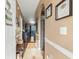 Inviting entryway with tile floors, arched doorway, and decorative wall hangings creates a warm welcome at 4173 Hibiscus Dr. # 204, Little River, SC 29566