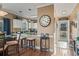 Bright kitchen leading to entryway with white cabinets, granite countertops, and a decorative backsplash at 4173 Hibiscus Dr. # 204, Little River, SC 29566