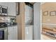 A stacked washer/dryer unit is featured adjacent to kitchen appliances and nearby storage at 4173 Hibiscus Dr. # 204, Little River, SC 29566