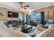 Inviting living room with fireplace, hardwood floors, comfortable seating, and sliding glass doors to balcony at 4173 Hibiscus Dr. # 204, Little River, SC 29566