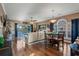 Open concept living room and dining area with hardwood floors, modern furnishings, and plenty of natural light at 4173 Hibiscus Dr. # 204, Little River, SC 29566
