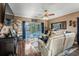 Cozy living room with hardwood floors, comfortable seating, a ceiling fan, and sliding glass doors to balcony at 4173 Hibiscus Dr. # 204, Little River, SC 29566